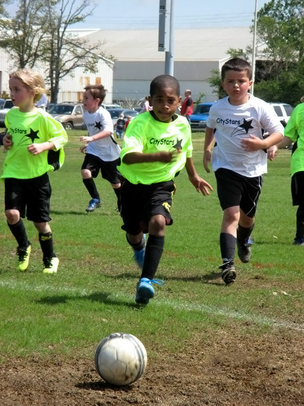 City Stars team members playing soccer