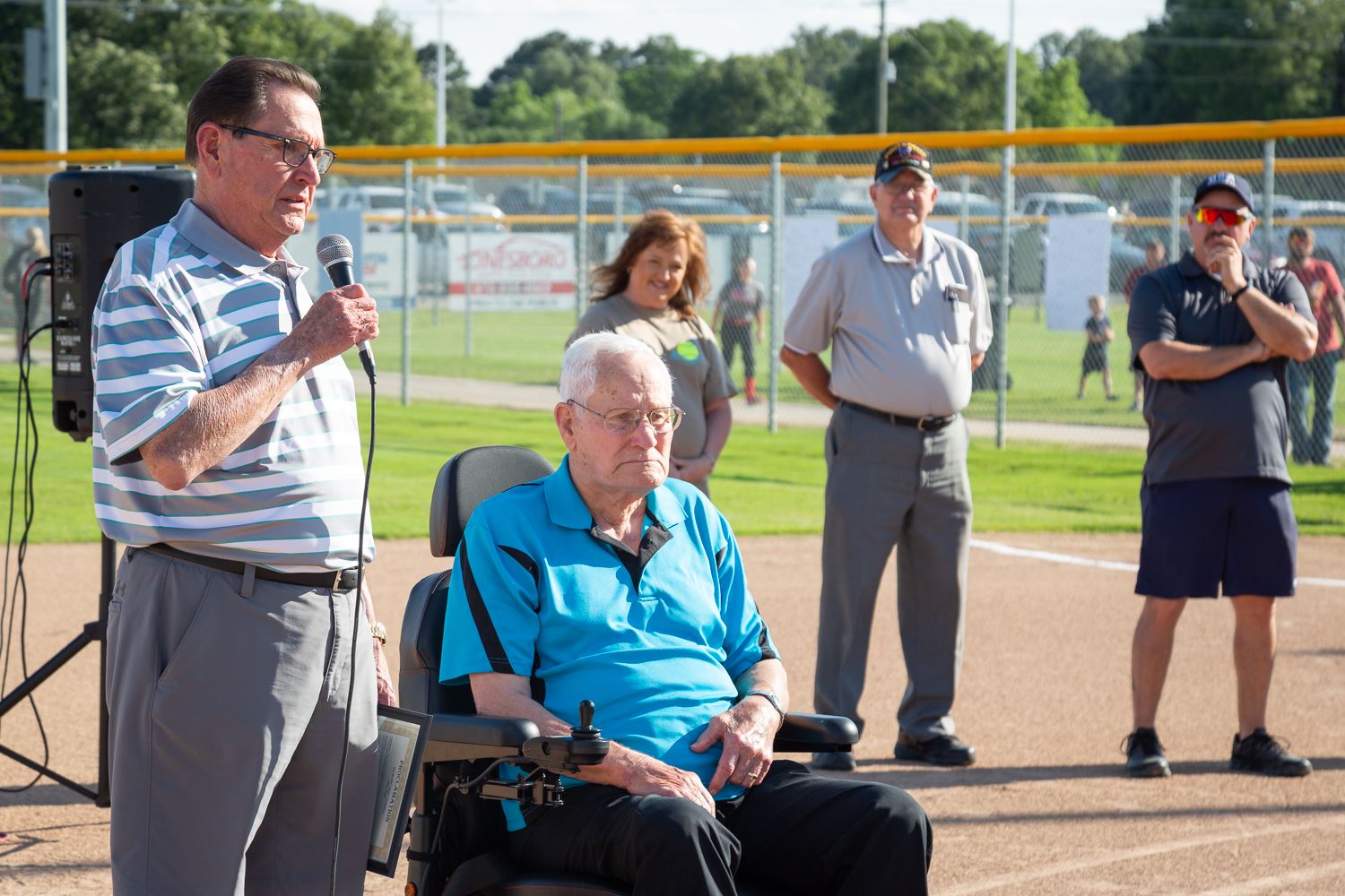 Harold Perrin gives talk about Pop Gibson at Southside Softball Complex with Pop Gibson next to him.