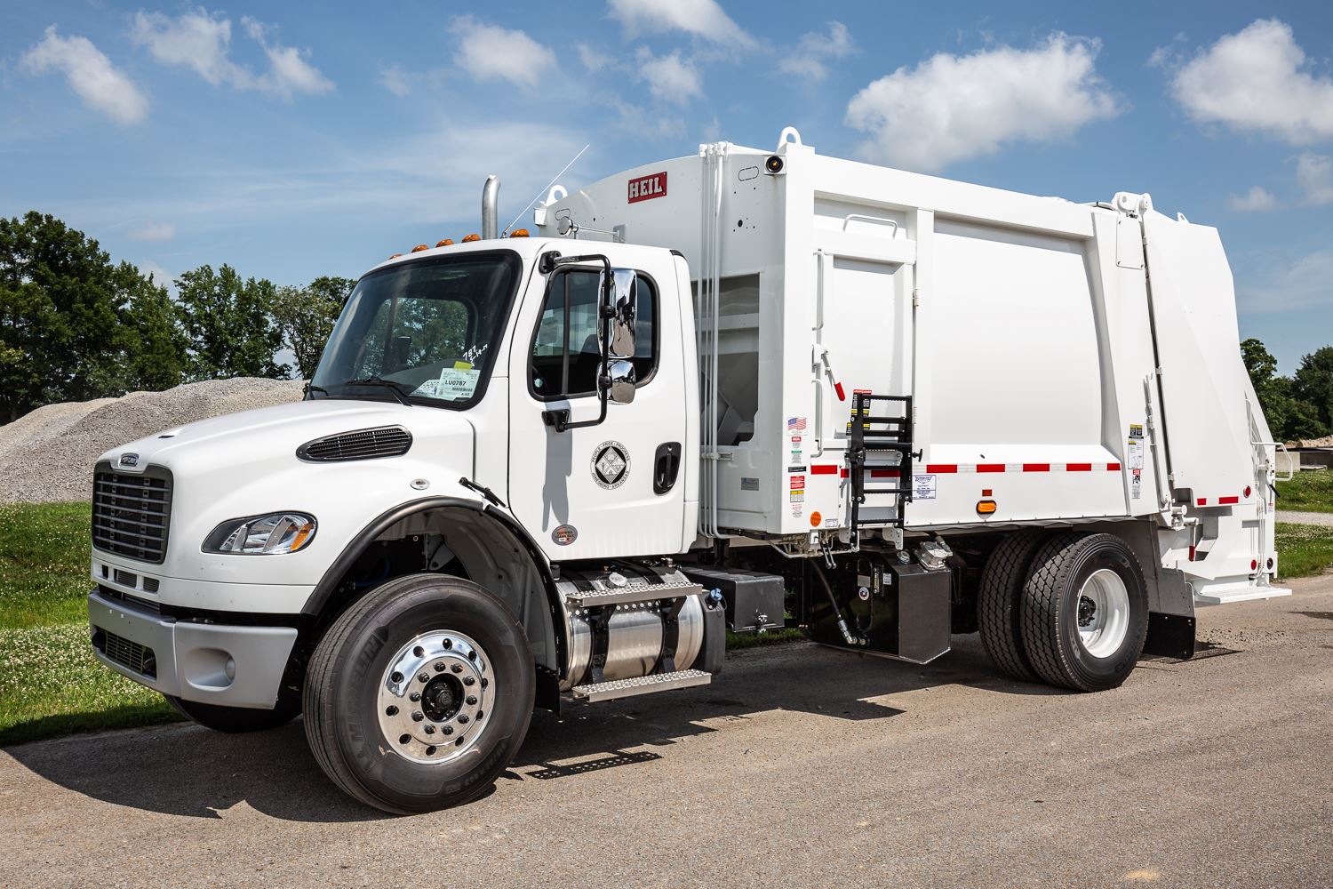 New sanitation truck sitting parked.