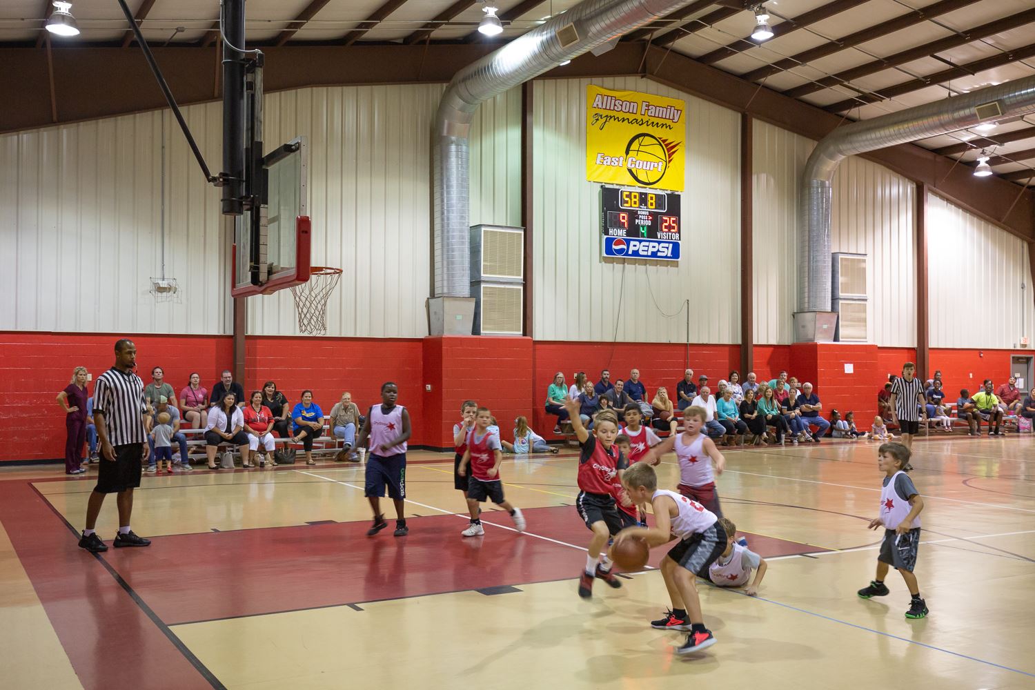 Kids playing basketball at Allen Park Community Center.