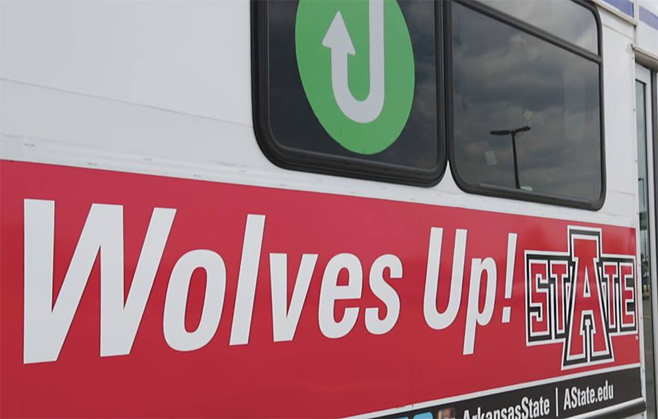 JET Bus with Wolves Up written on the side.