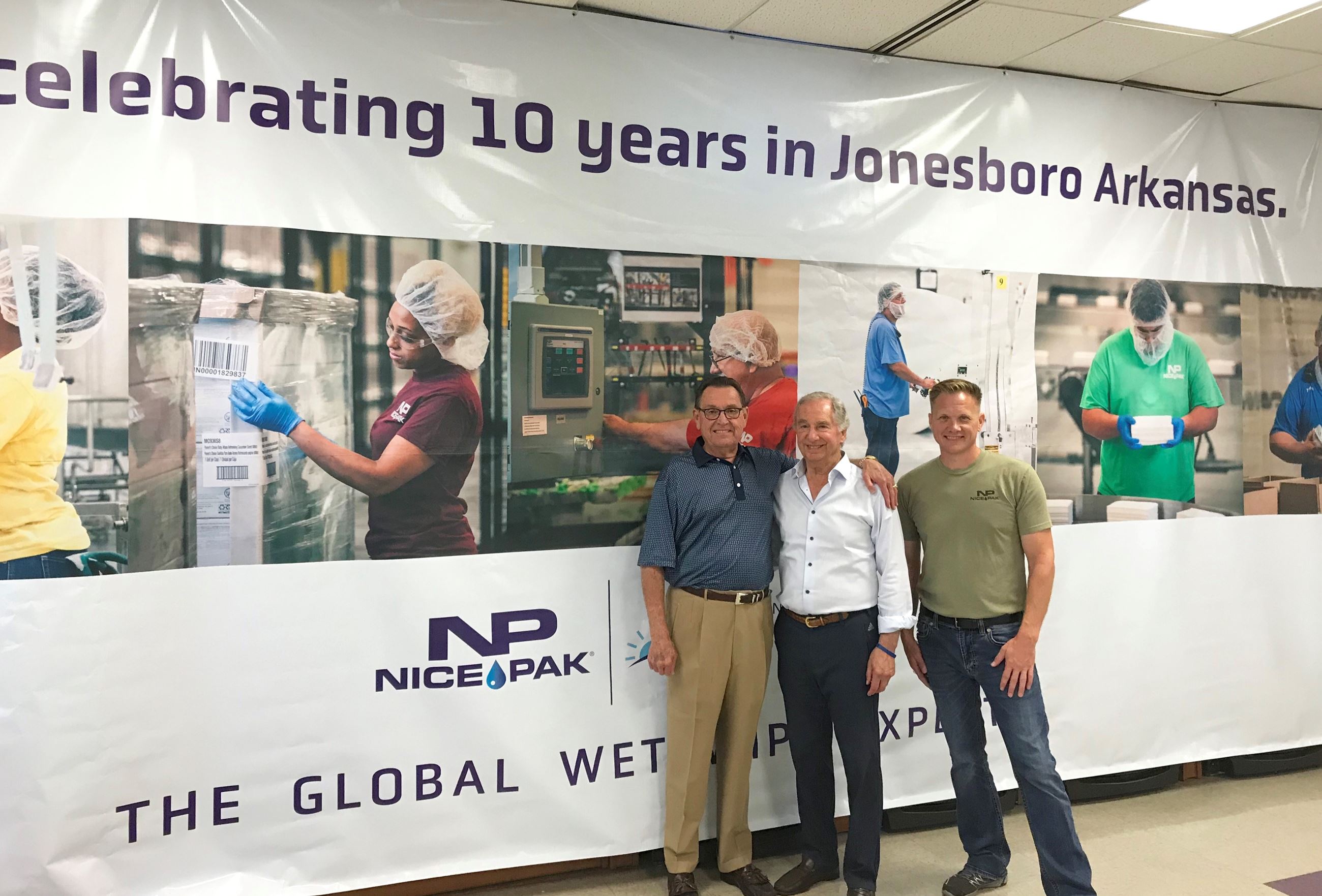 Mayor Perrin with Nice Pak owner Robert Julius and Stanley Lichucki.