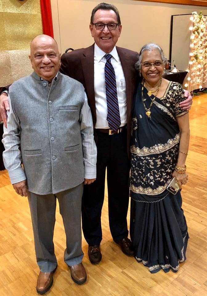 Mayor Perrin with Indian man and woman who are dressed in traditional clothing of their country