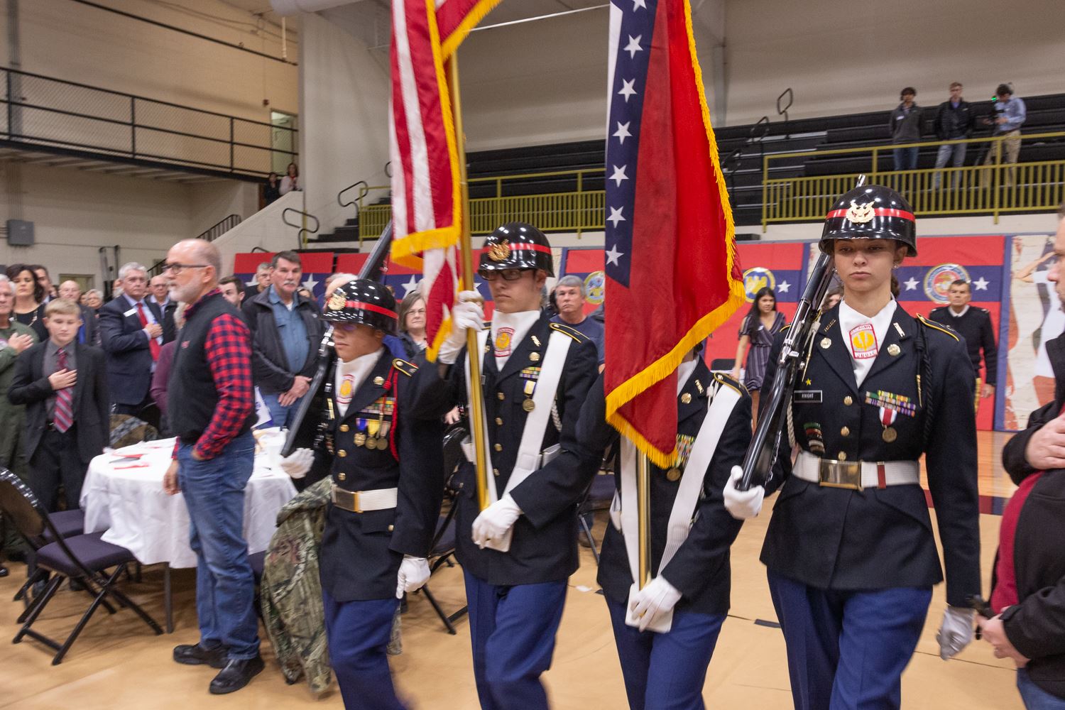 ROTC students march with the flag for presentation of the colors