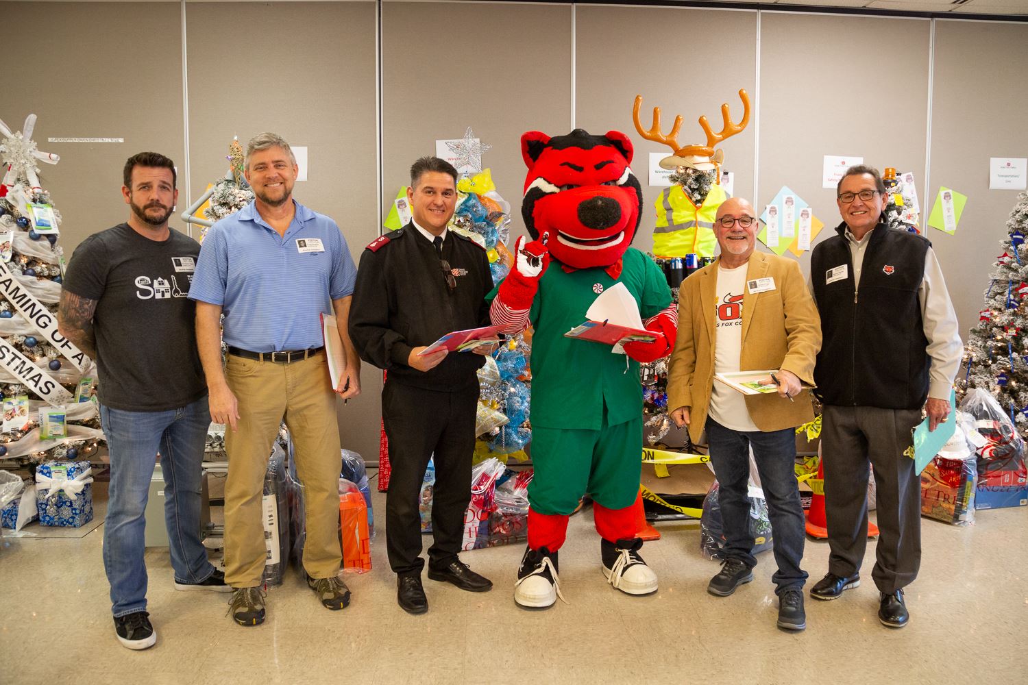 Mayor Perrin along with other Jonesboro business and non-profit leaders pose in front of the Angel T