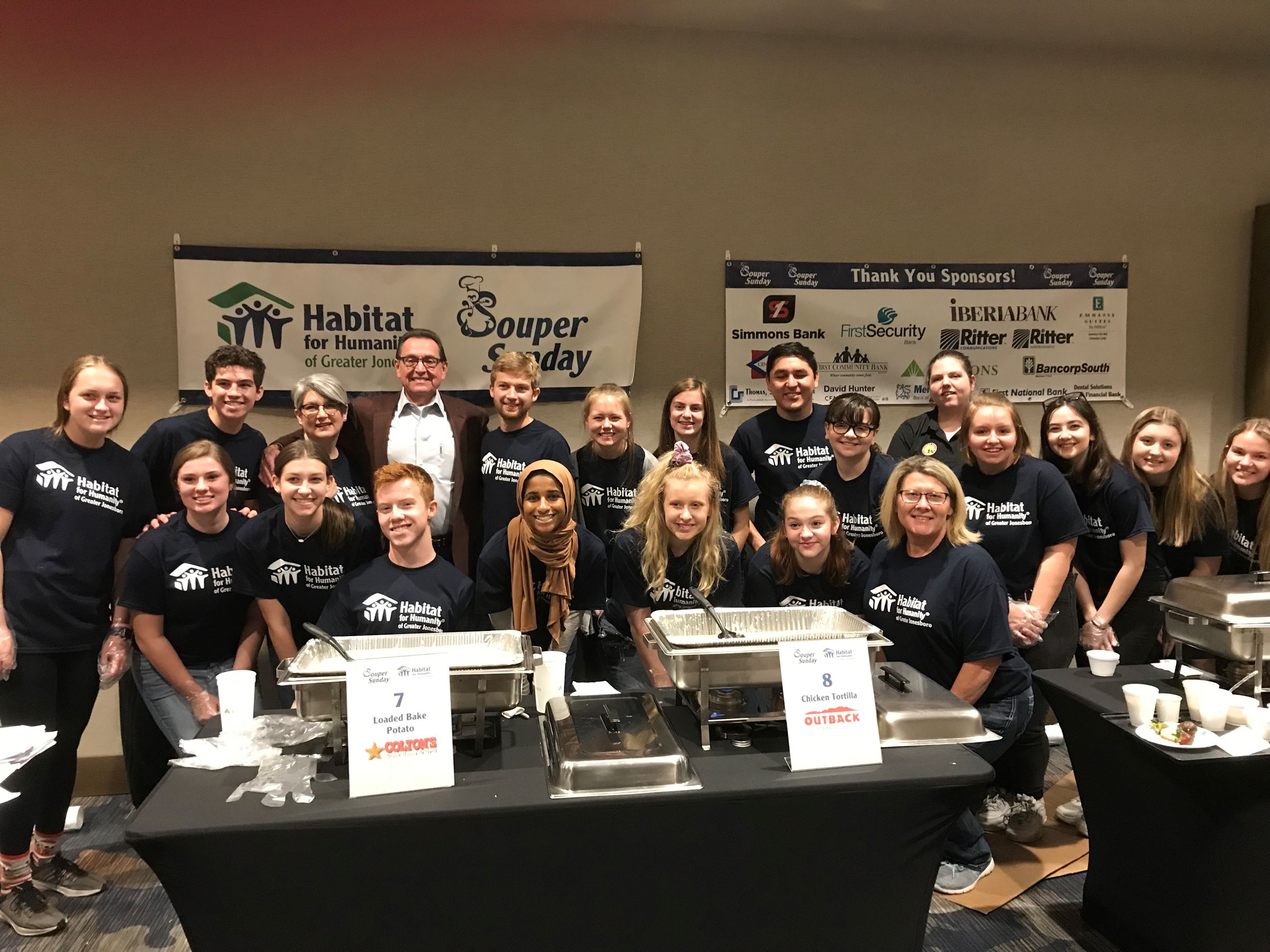 Mayor Perrin posing with Habitat for Humanity volunteers