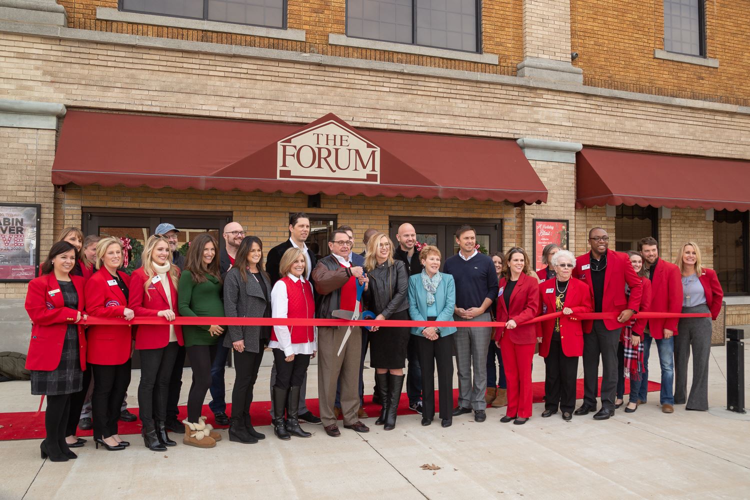 Mayor Perrin along with members of the Jonesboro Regional Chamber of Commerce holding the red ribbon