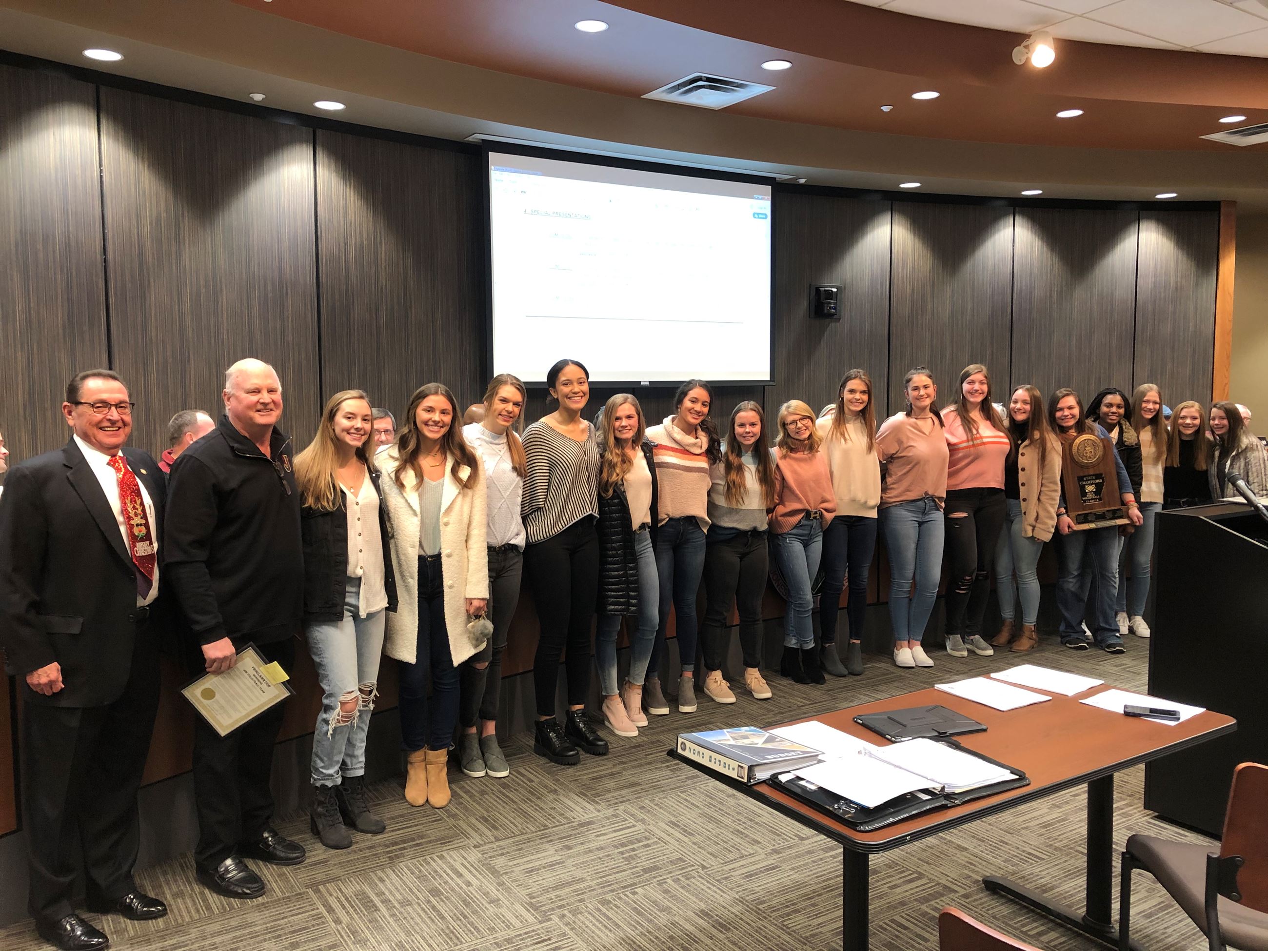 Jonesboro High School volleyball team with Mayor Perrin standing together