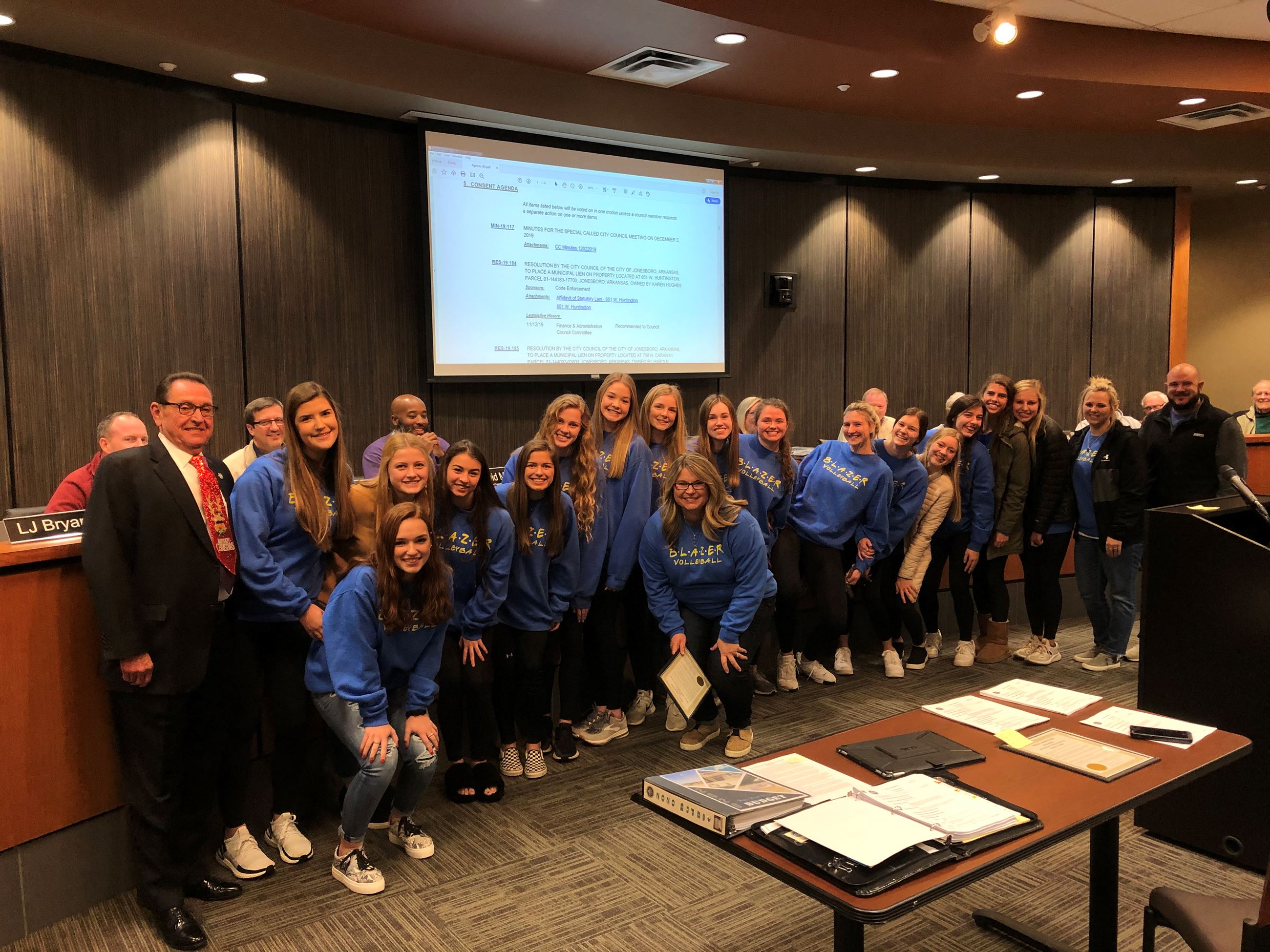 Valley View Volleyball Team standing posed with Mayor Perrin