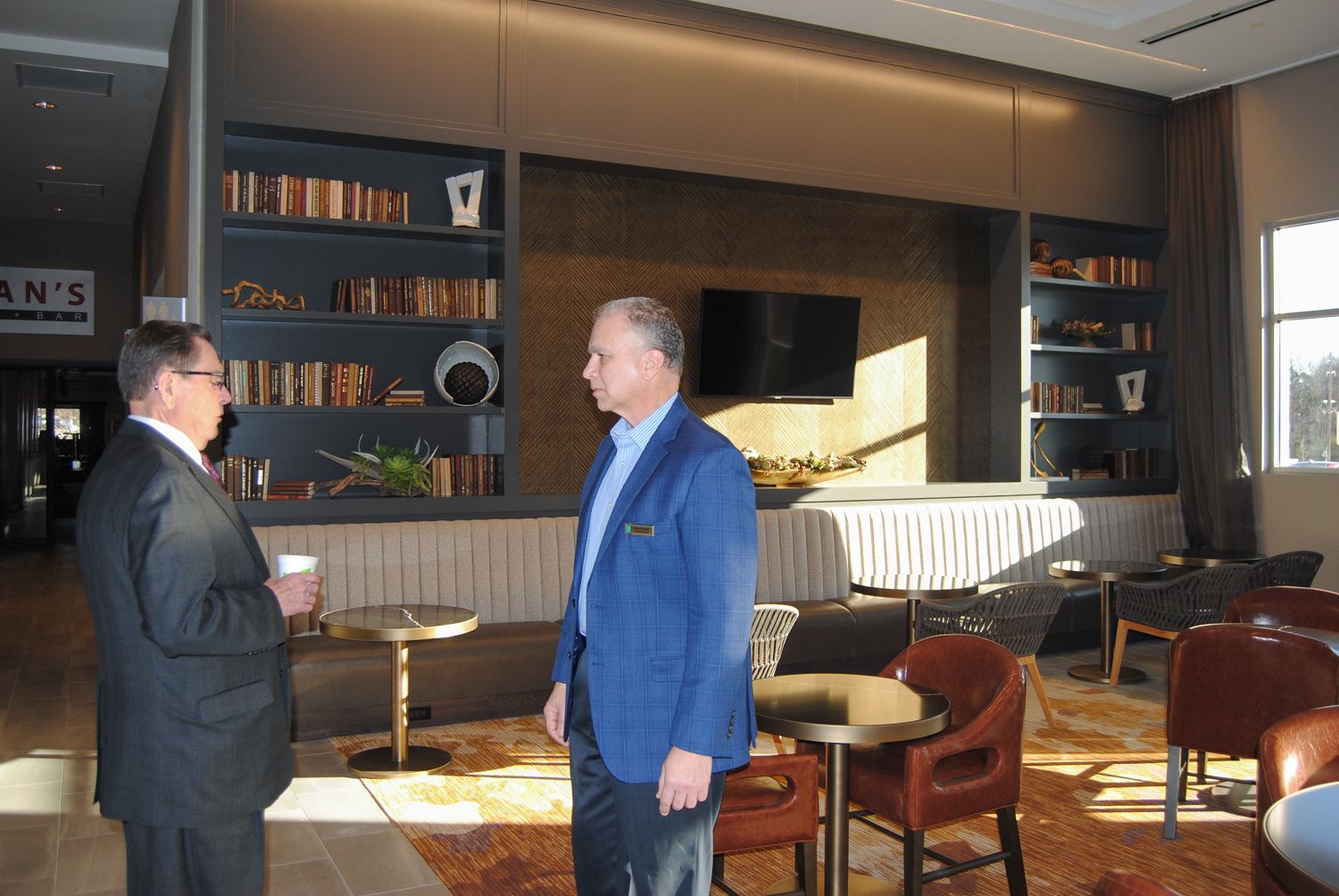 General Manager Pomrenke giving tour of hotel to Mayor Perrin