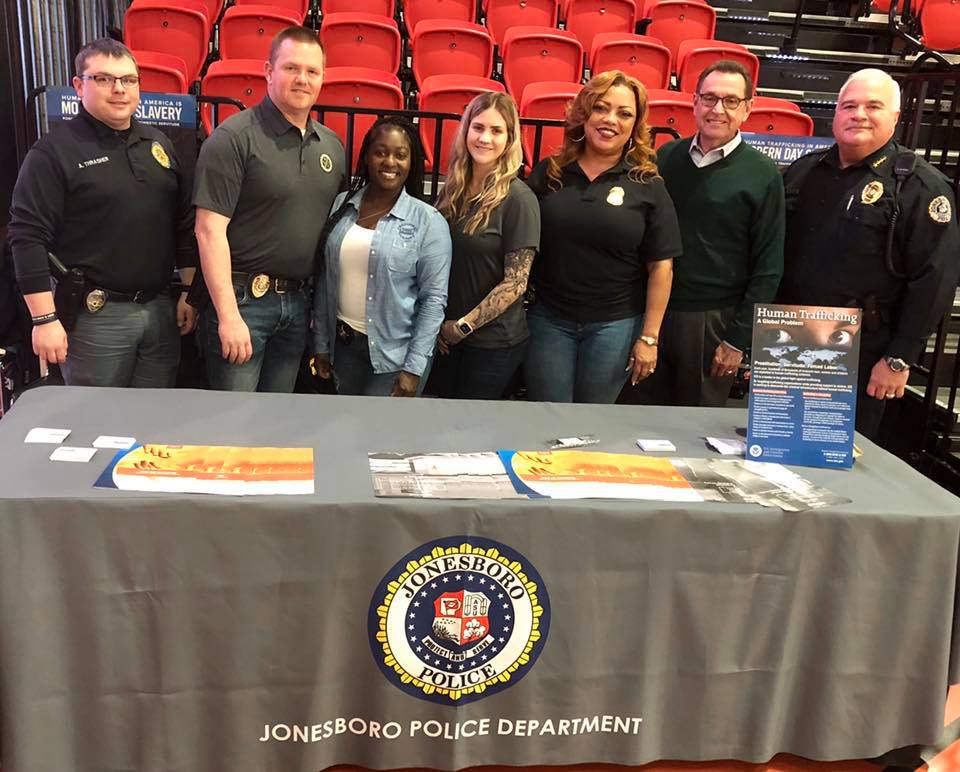 Law Enforcement agents along with Mayor Perrin and Chief Rick Elliott posed together at info table o