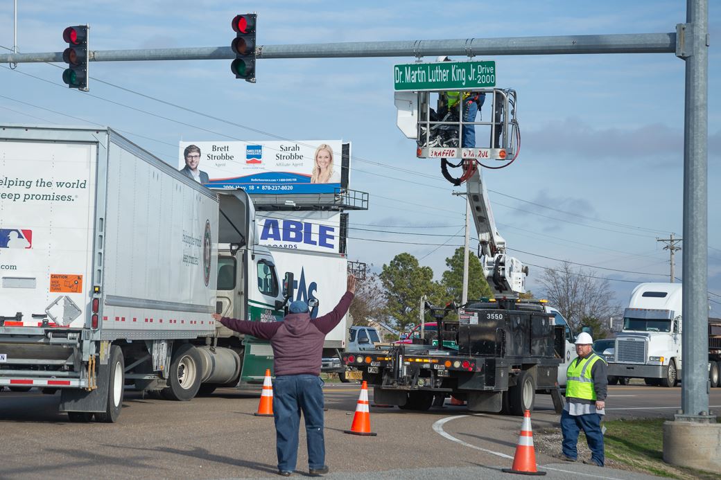 City of Jonesboro Street Department employees unveiling sign for Dr. Martin Luther King Junior Drive