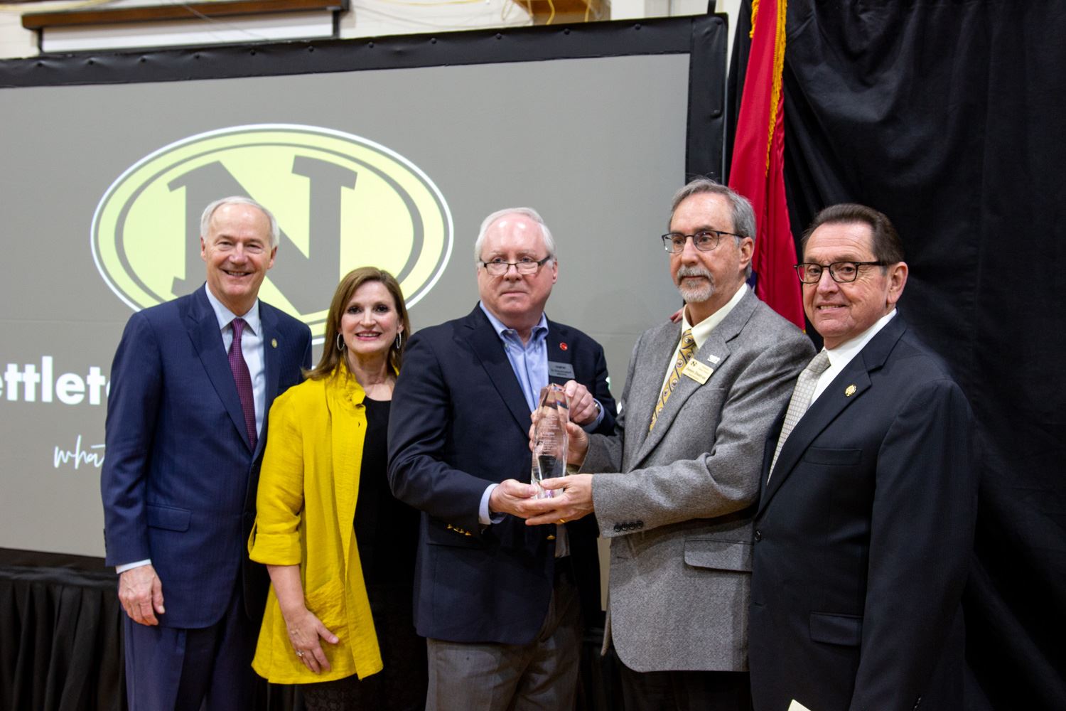 Nettleton STEAM Cognia STEM certification celebration group photo with governor, mayor, principal, o