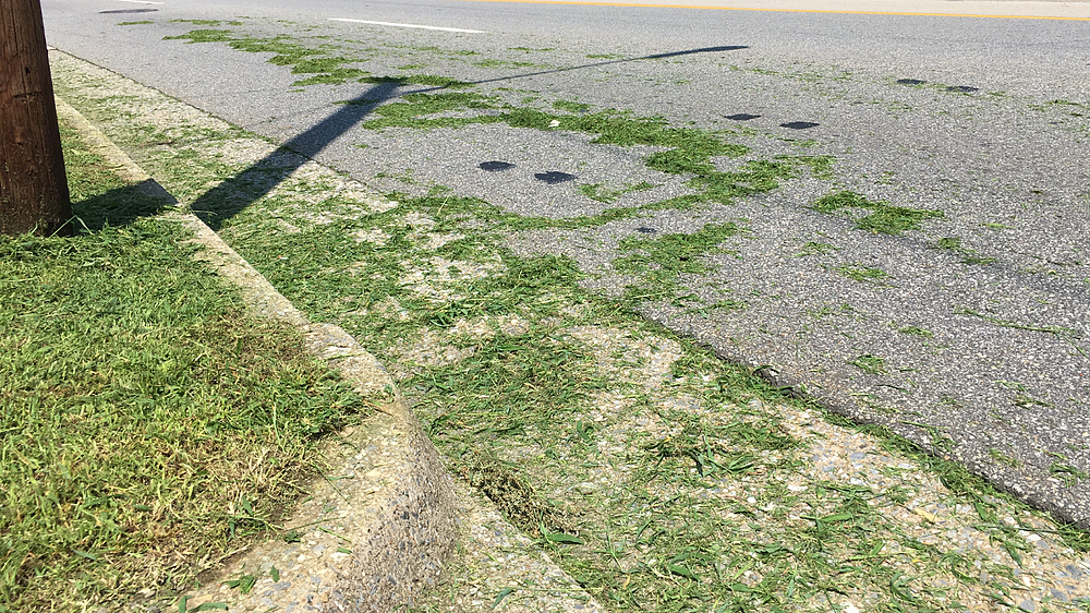 Grass clippings on road