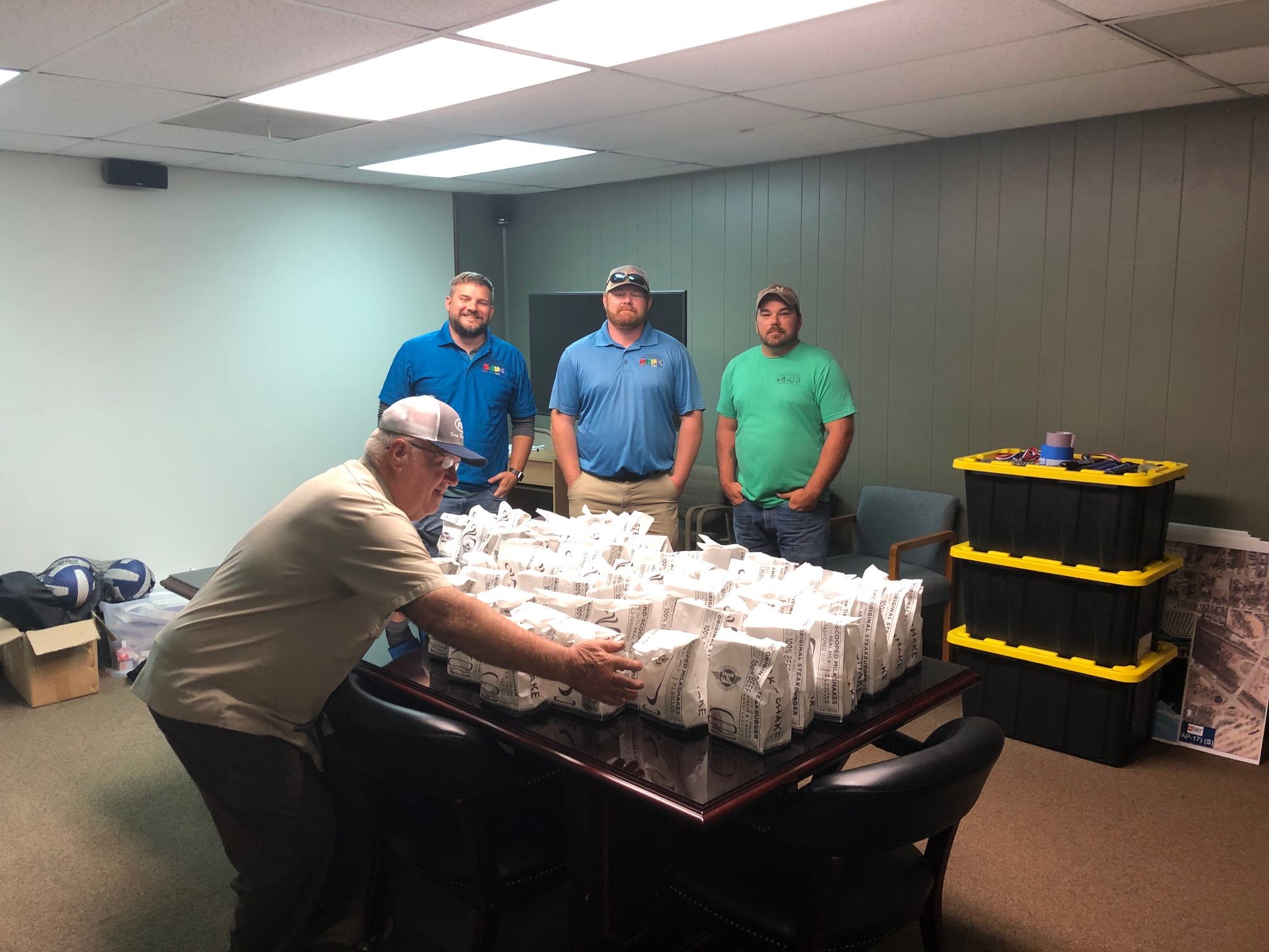 Parks and Recreation and Cemeteries employees with table full of Steak 'n Shake food