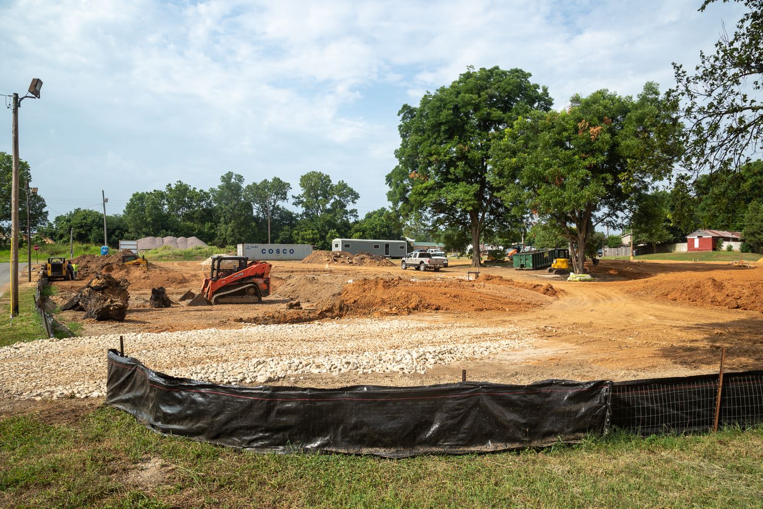Small bulldozers and dirt work at the site of the future Veterans' Village