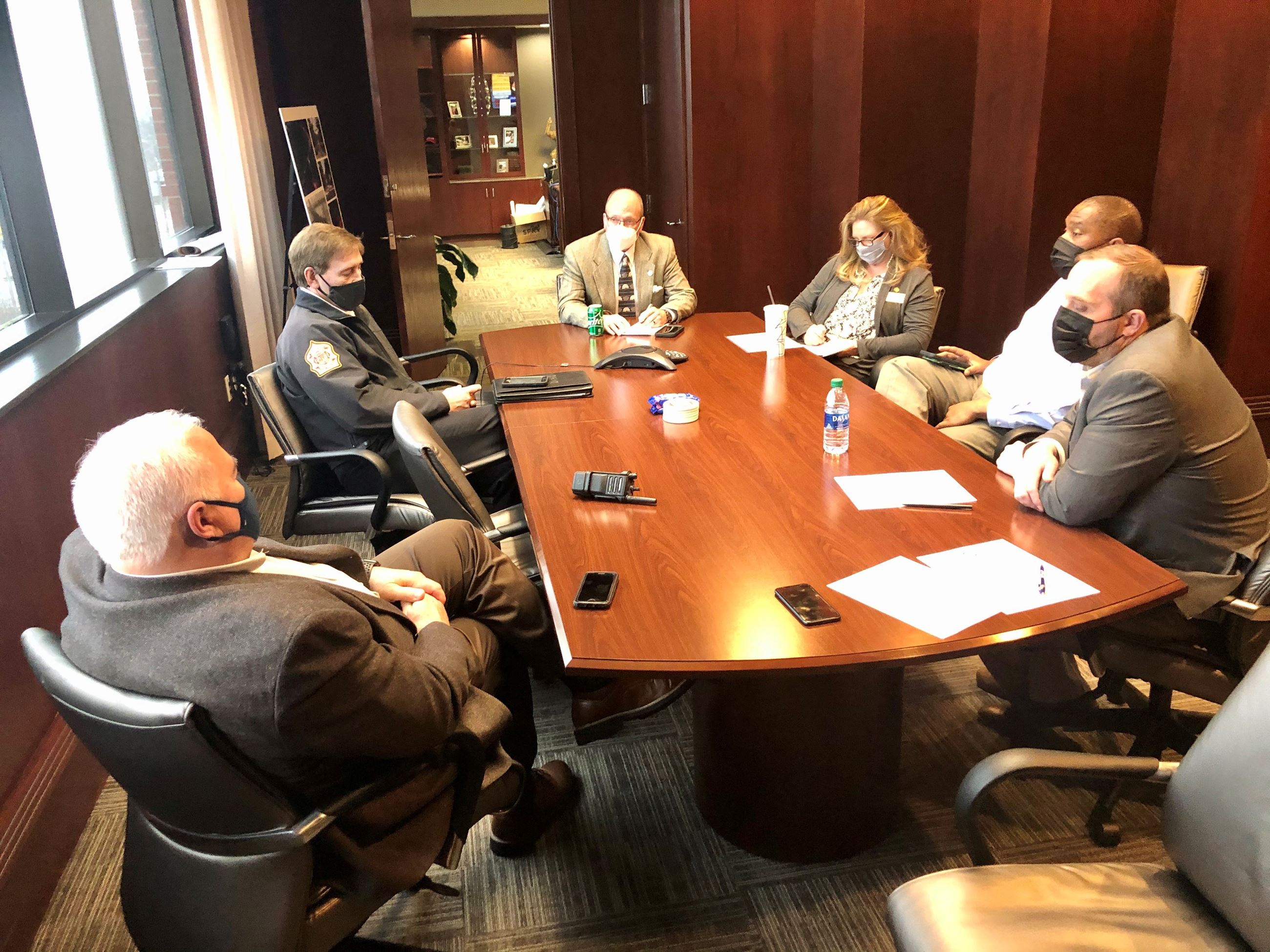 Mayor Copenhaver and administrative staff at table planning for inclement weather  