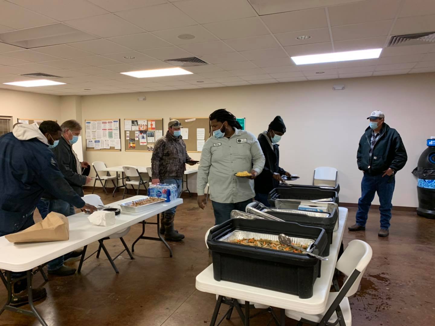Street Department employees getting food from tables