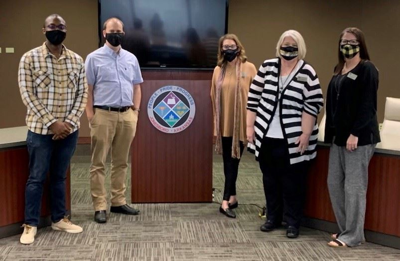 Left to right stands Cameron Robinson, Brandon Carter, Tammy Rainwater, Debra Johnson, Renee Brow