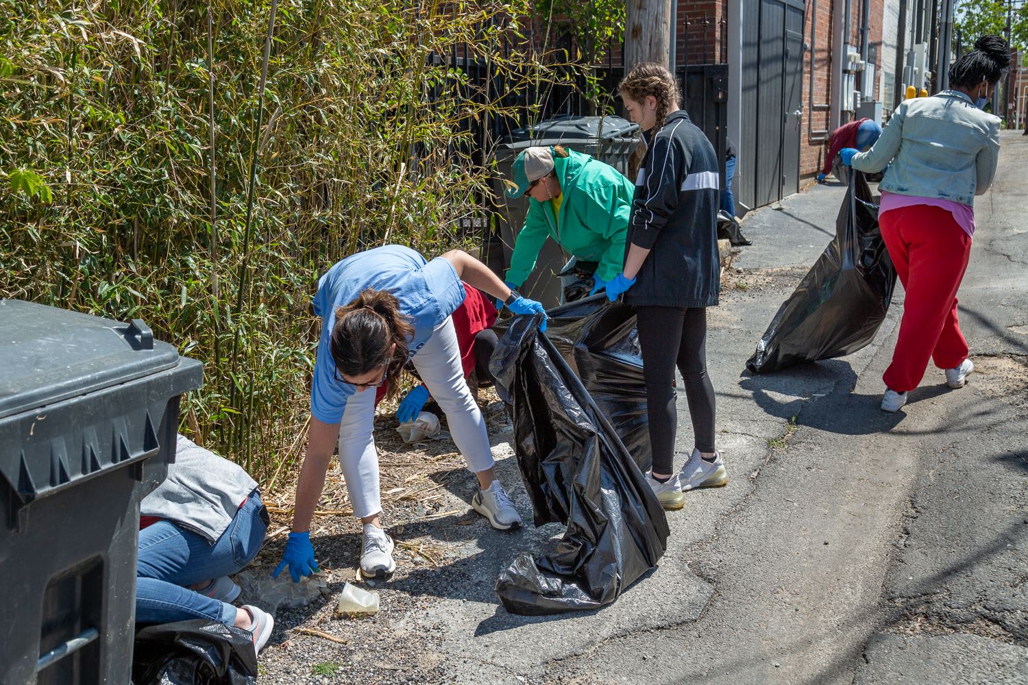 Volunteers picking up trash downtown