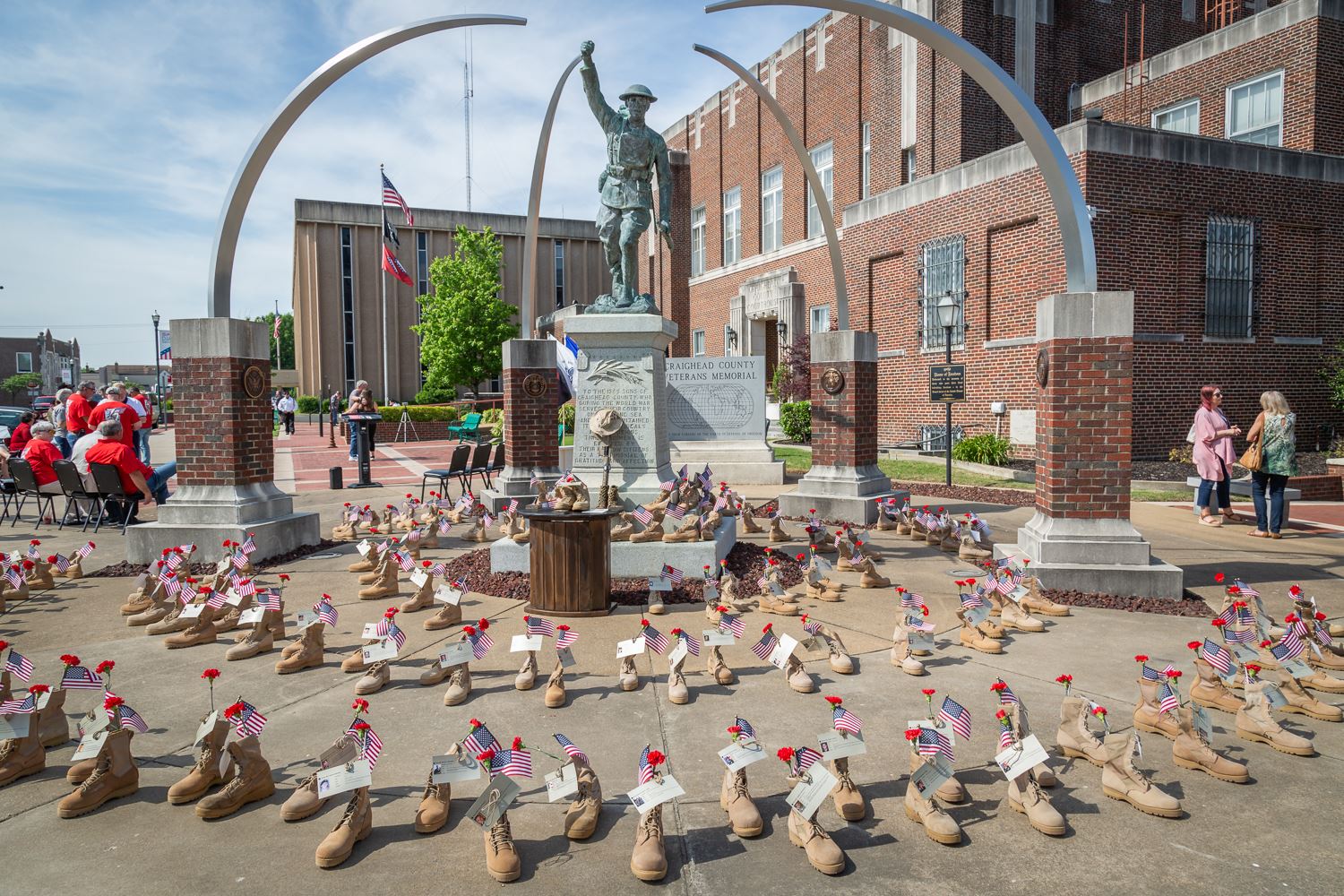 Combat boots surround the Craighead County Veterans Memorial
