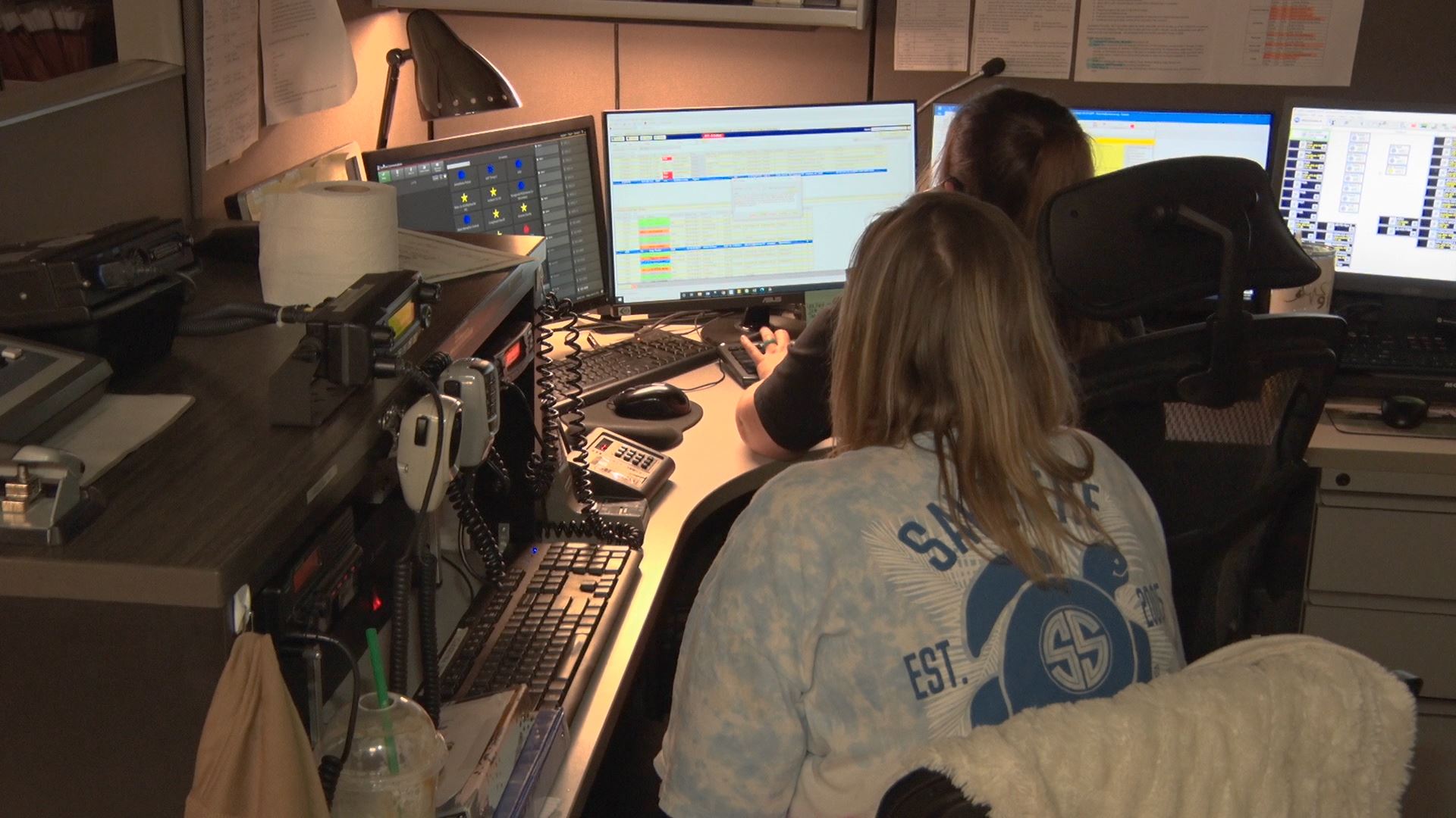 Dispatchers at computer and radios
