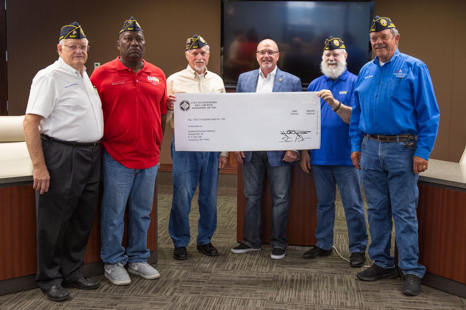 Mayor Copenhaver with members of the local DAV Chapter 26 holding a large check for $5,000