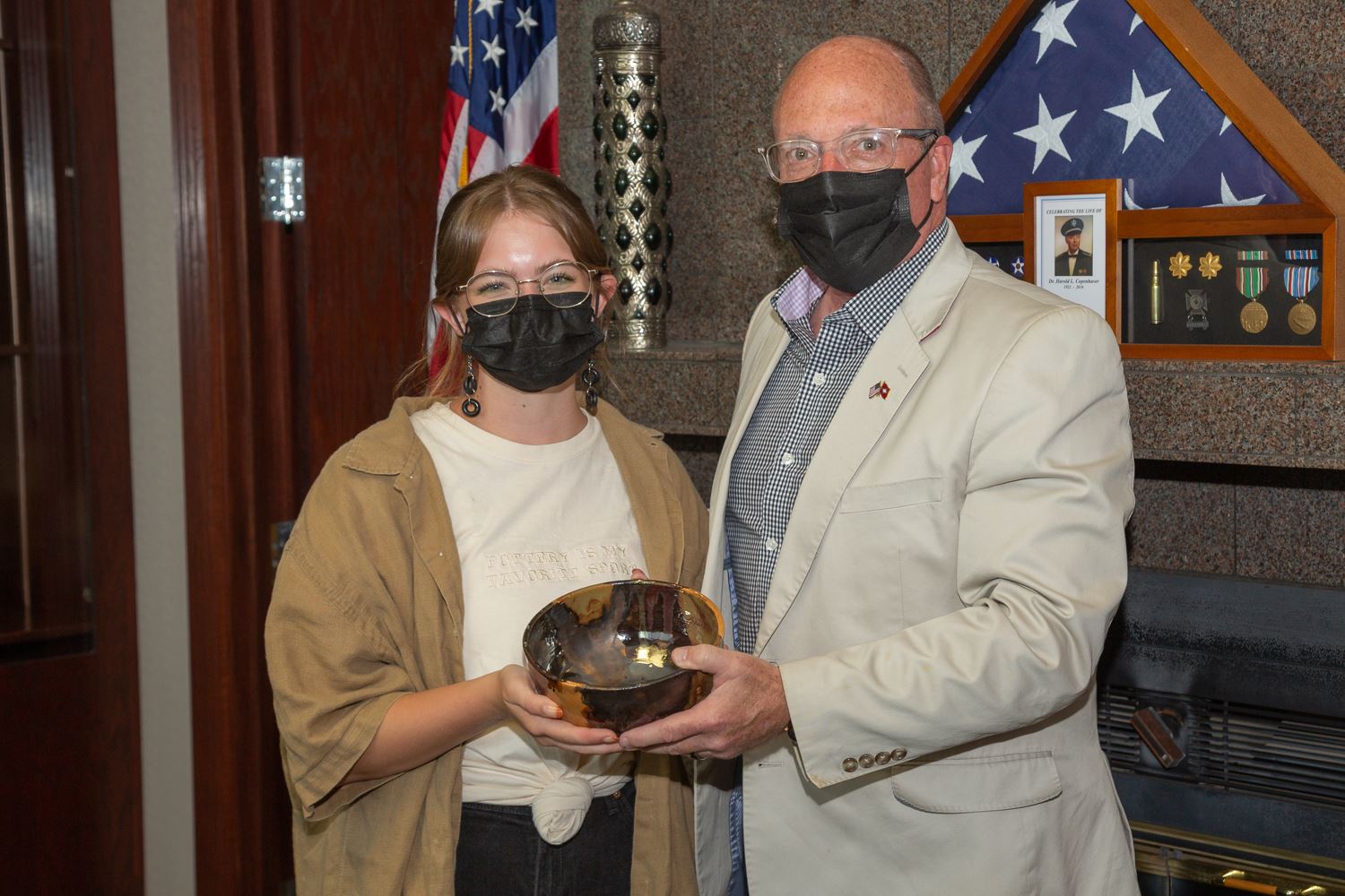 Claire Waltz and Mayor Copenhaver holding the bowl she made to give to him