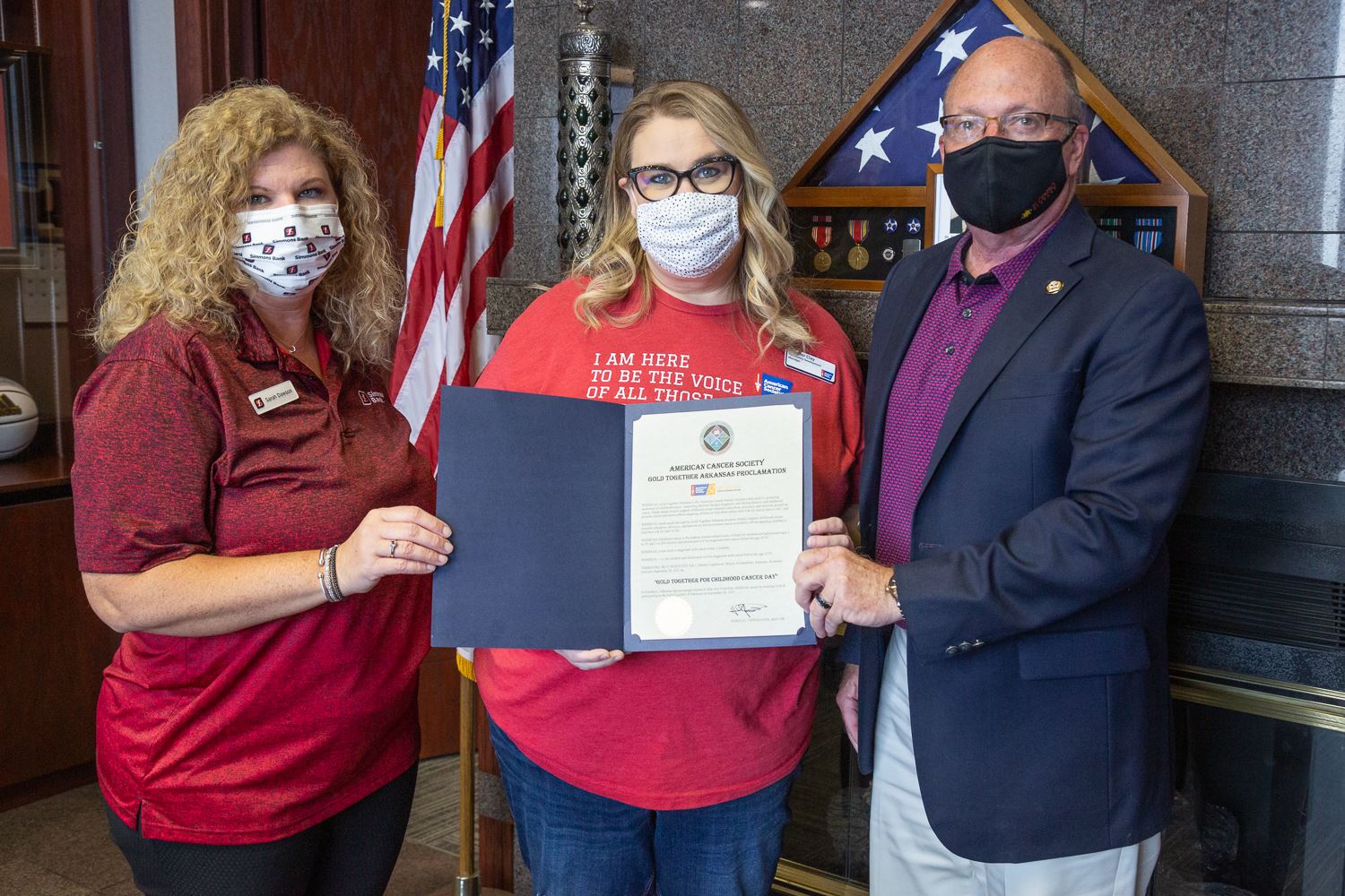 Sarah Dawson, Jennifer Clay, and Mayor Copenhaver holding the proclamation for Gold Together