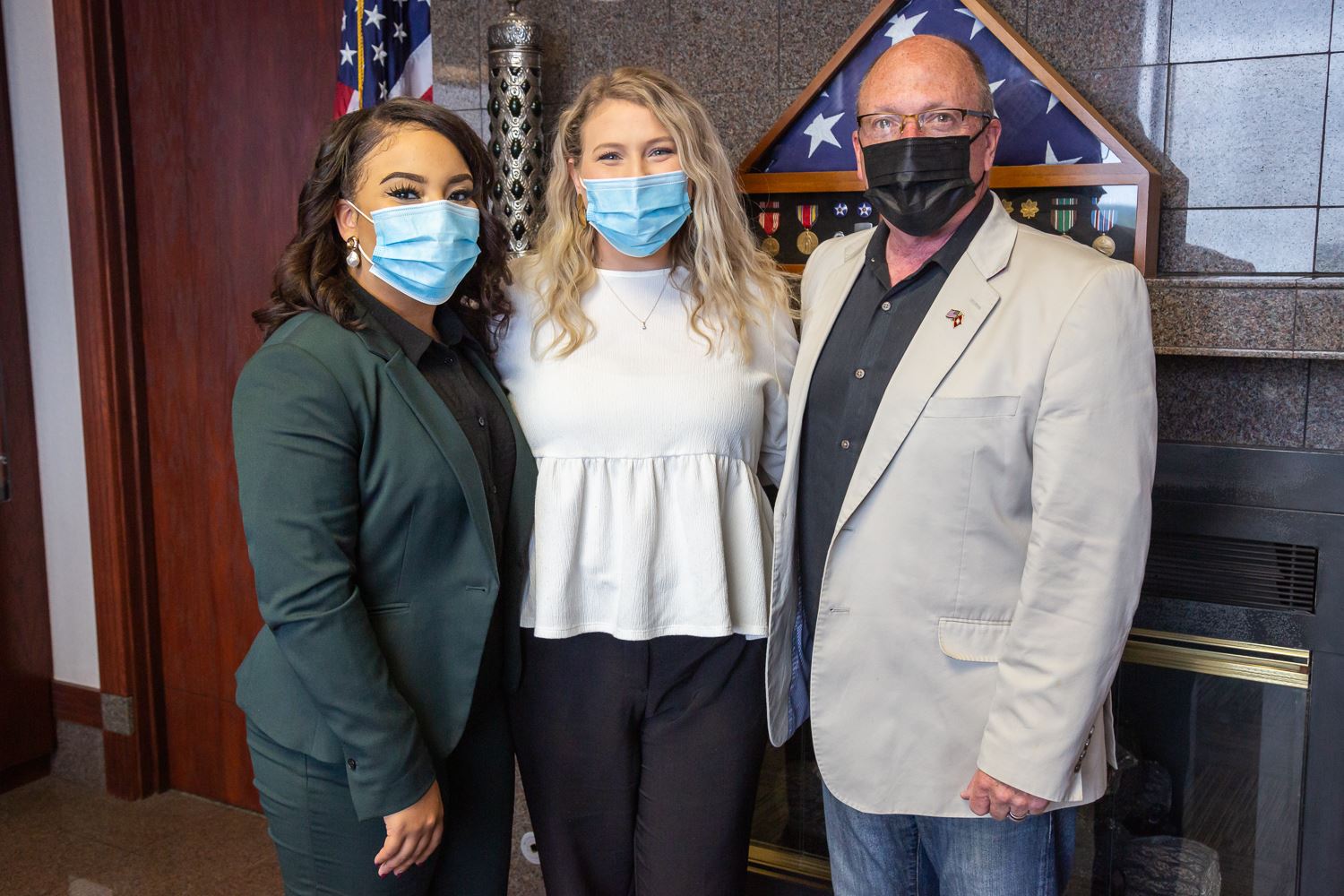 Programming Director Briana Richards, Executive Director Hannah Caddy, and Mayor Harold Copenhaver