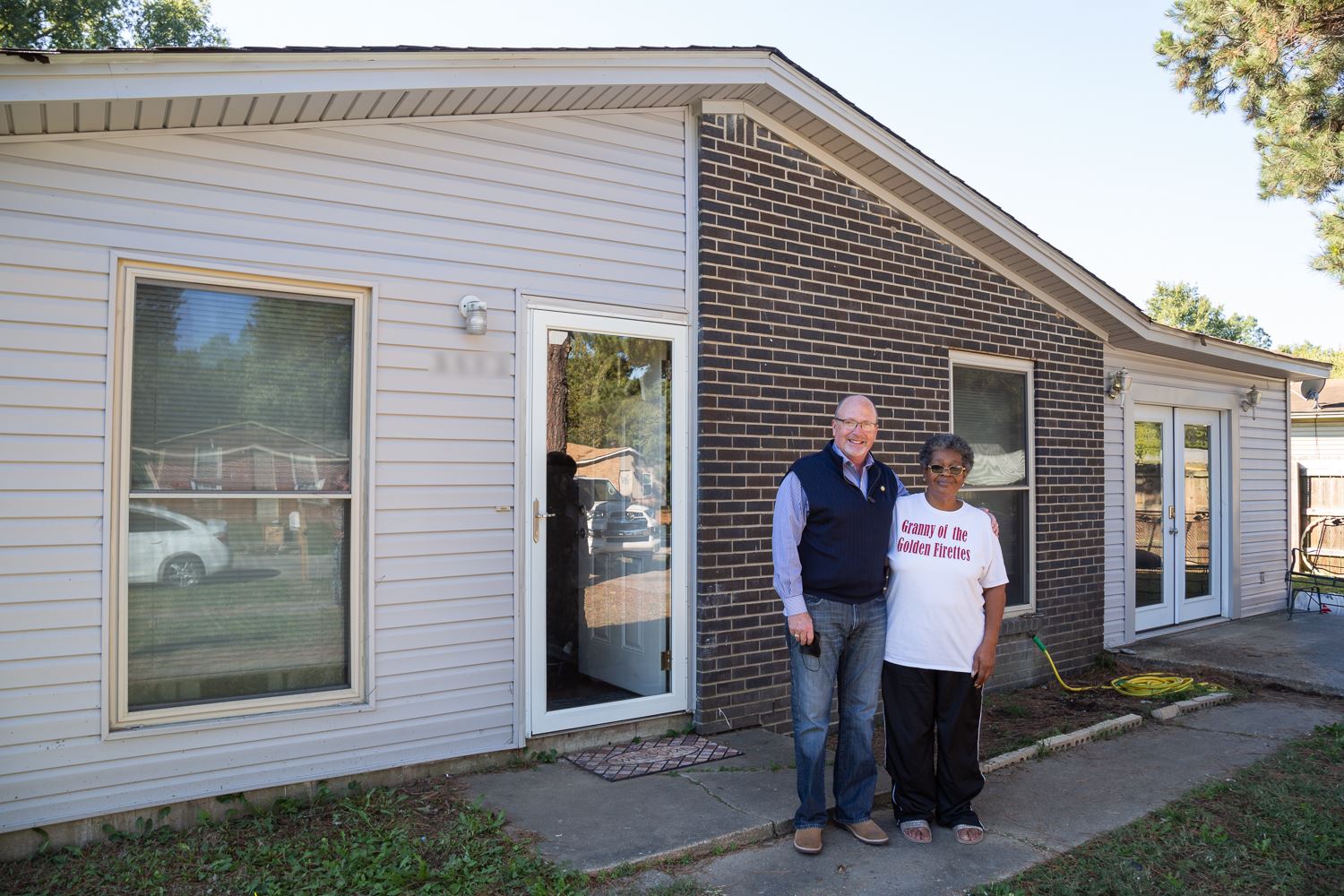Mayor Copenhaver and Ms. Martha Pickett standing in front of her house with the new improvements