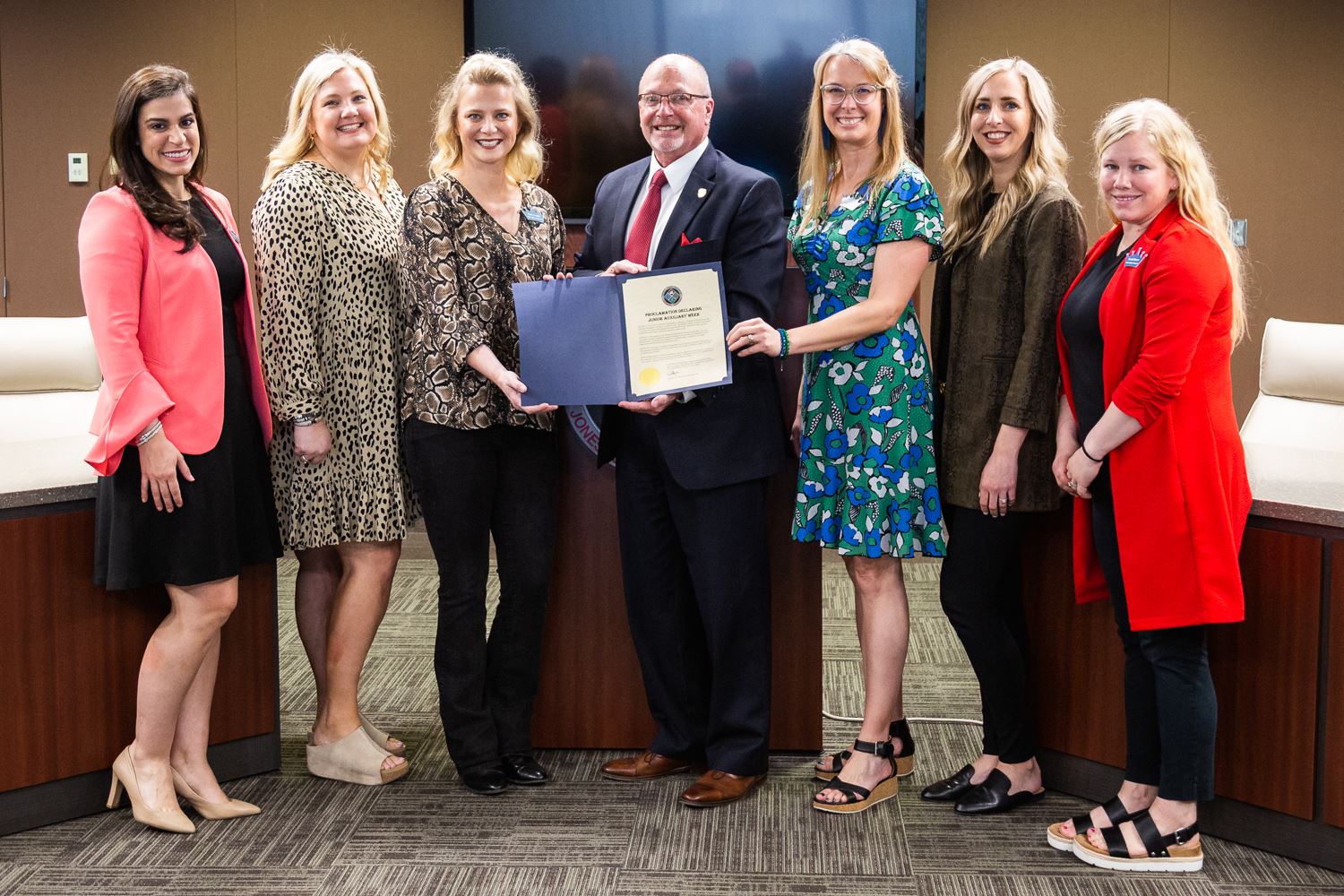 Junior Auxillary officers standing with Mayor Copenhaver who is holding proclamation