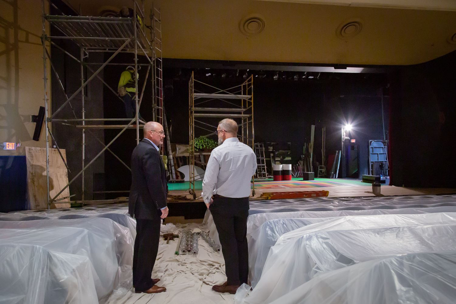 Mayor Copenhaver talking to Mikel Wewers with renovation work going on in background