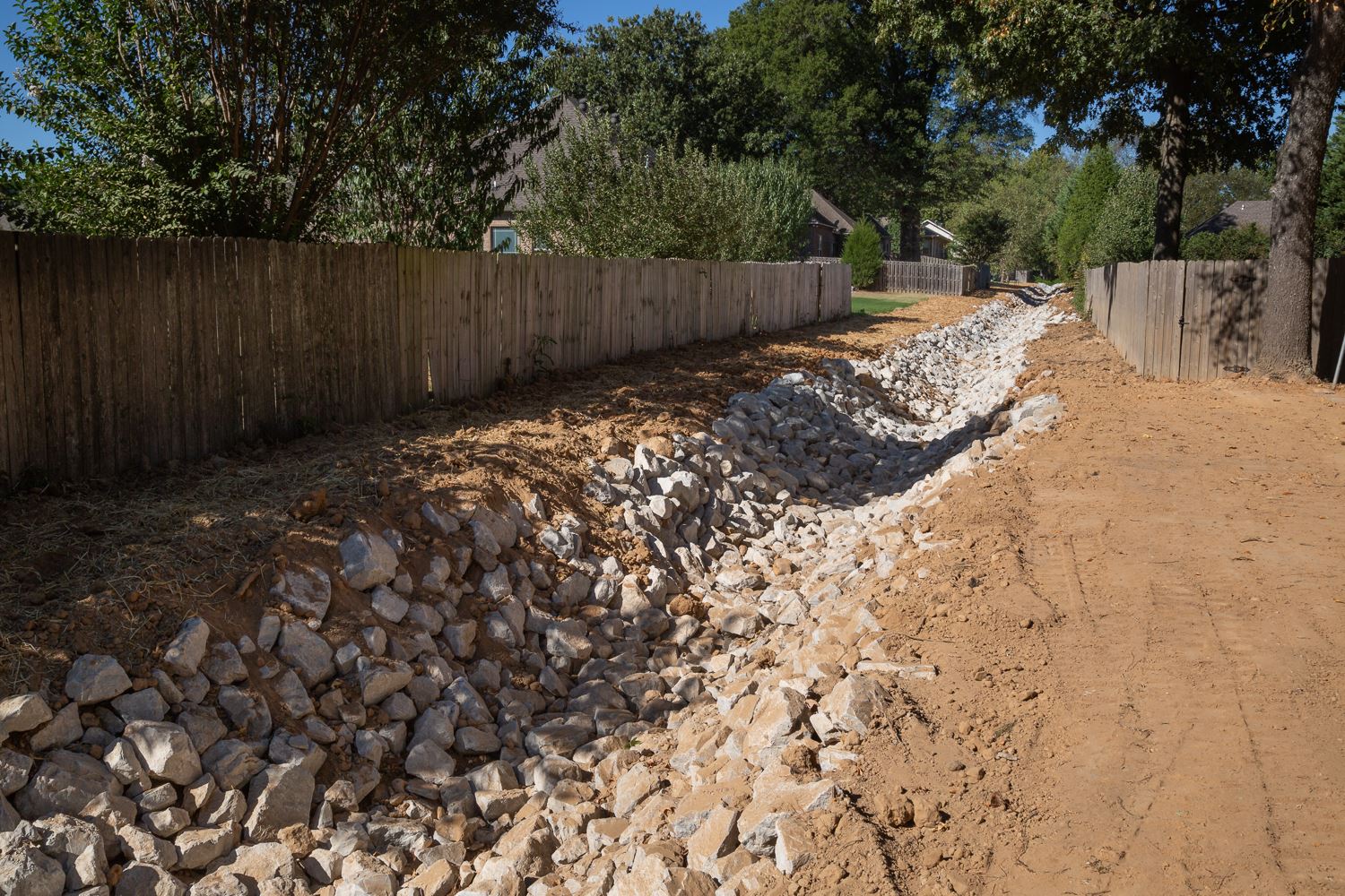 Drainage ditch lined with rocks