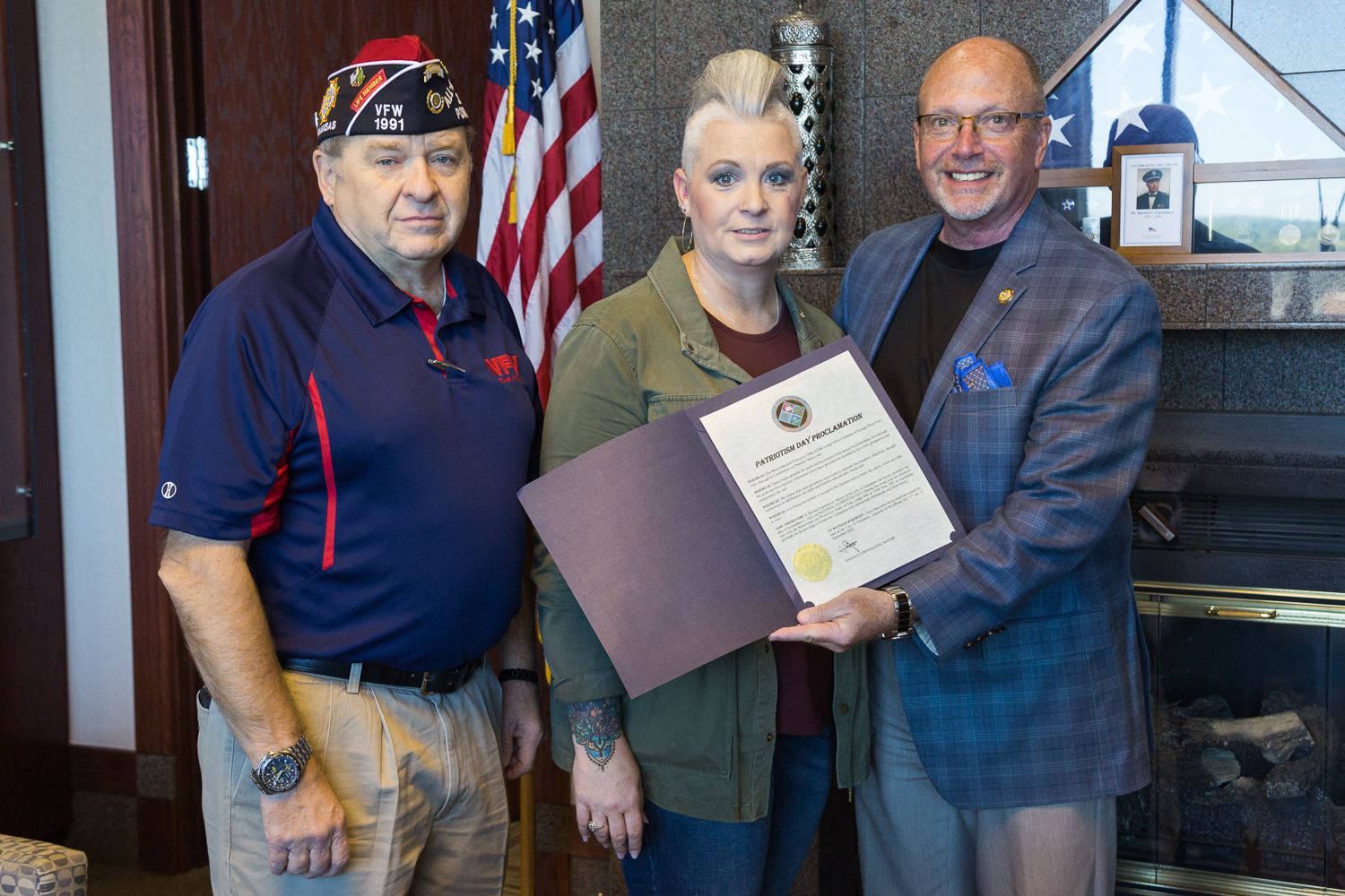 Two members of Jonesboro Elks with Mayor Copenhaver who is holding proclamation
