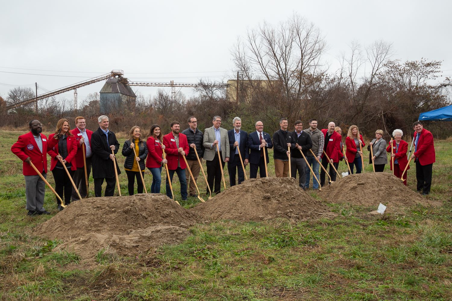 Mayor Copenhaver, Chamber of Commerce and other partners standing with shovels