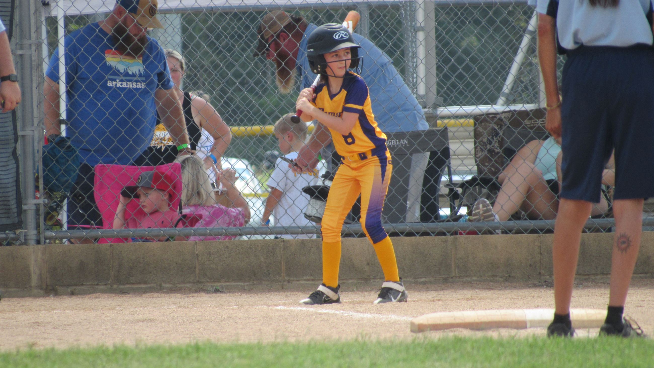 Young softball player at the bat