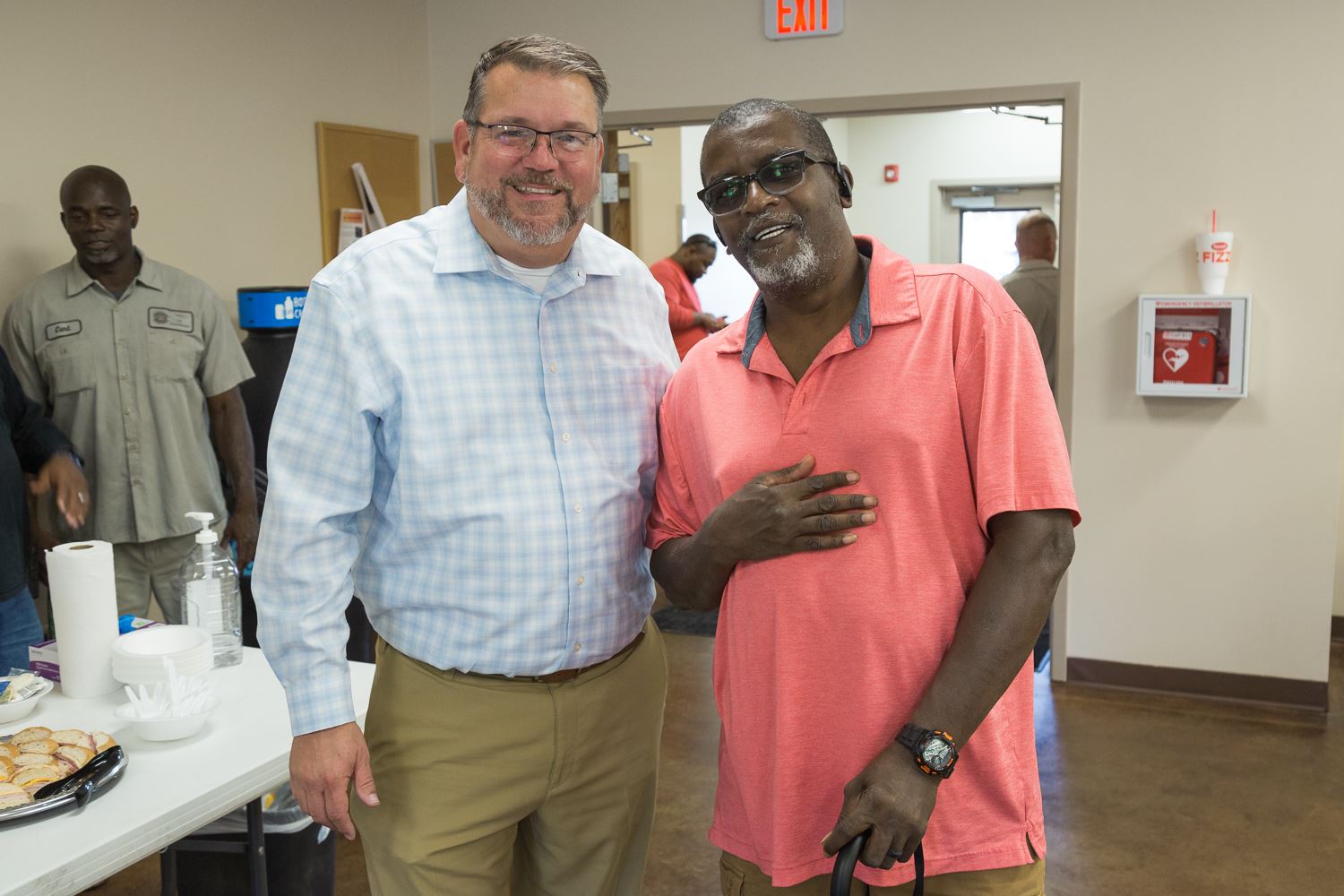 Alfred Thomas standing next to Sanitation Director Patrick Courtois