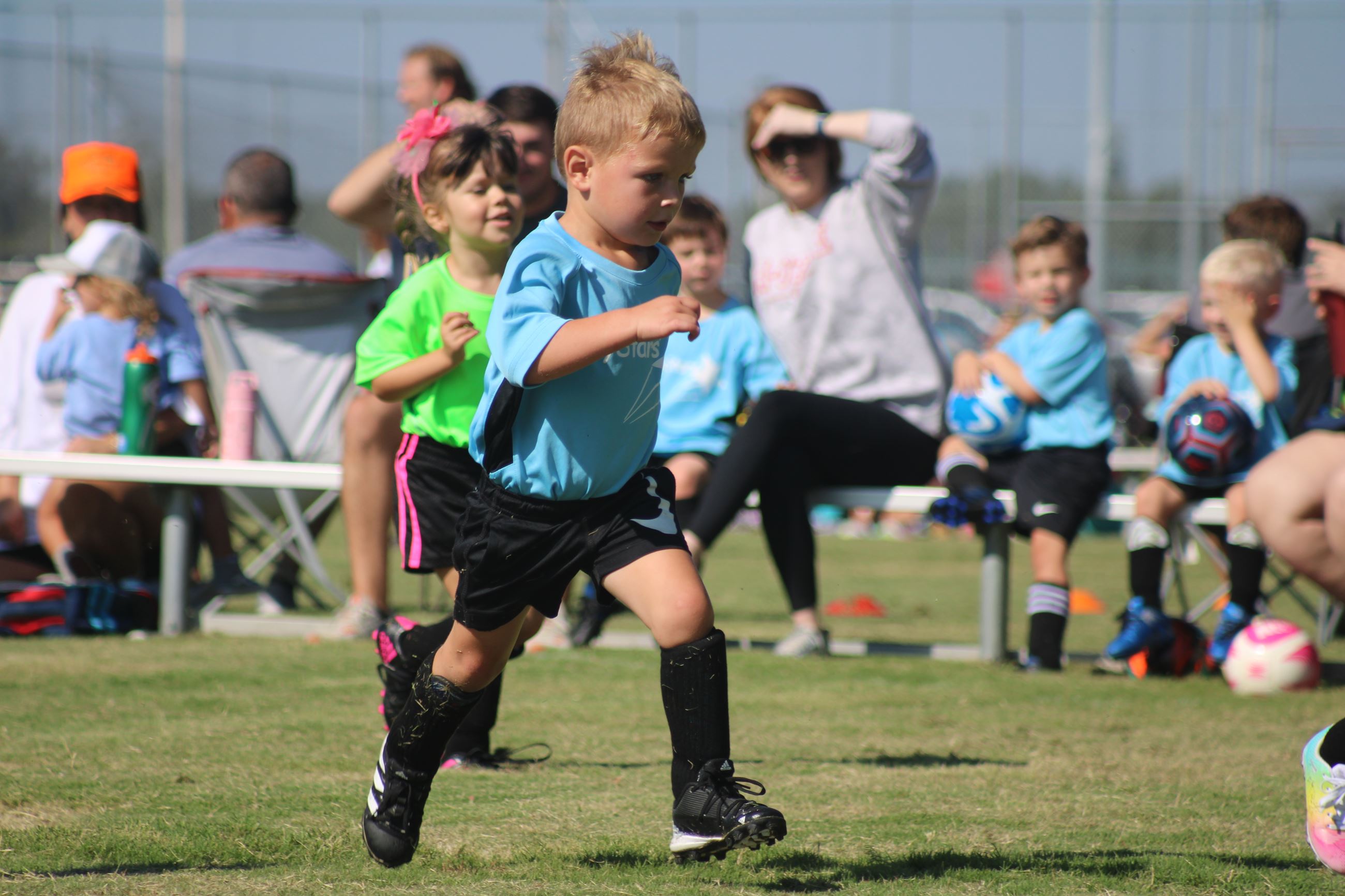 Small kids playing soccer