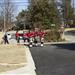 Jonesboro Firefighters Pipe Band marching together while playing bagpipes